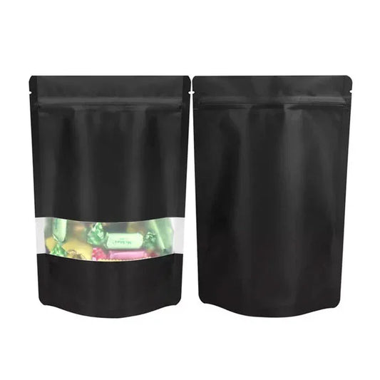 Black stand-up zipper pouch with clear window, ideal for candy or snack packaging