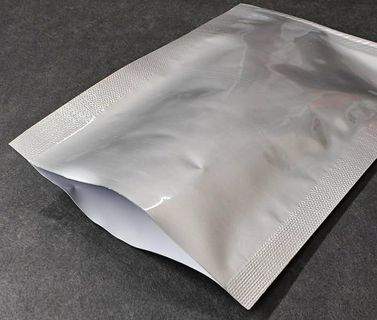 Shiny silver stand-up pouch with textured seal, ideal for premium flexible packaging in Bangladesh