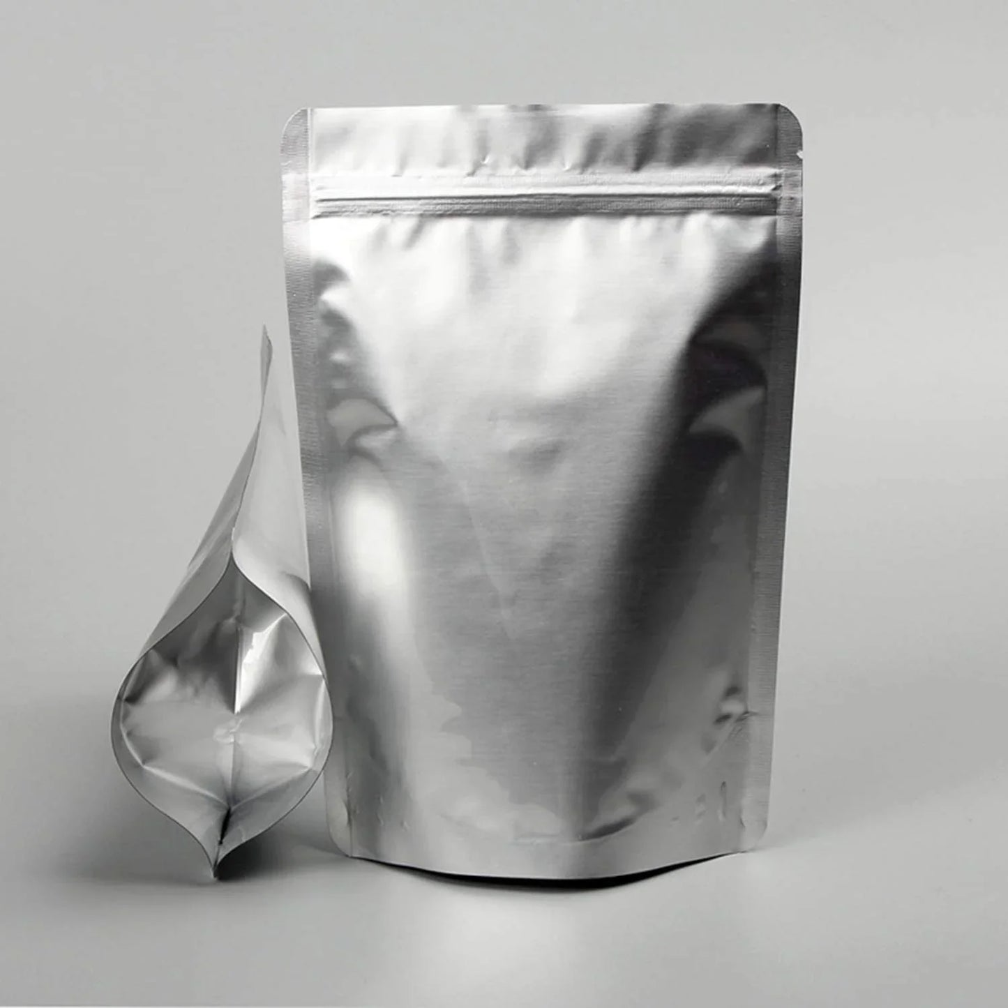 Shiny silver stand-up zipper pouch with resealable top, ideal for premium product packaging