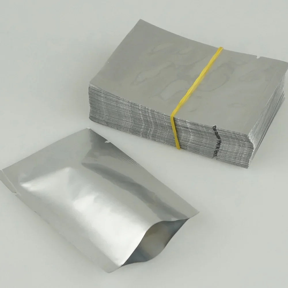 Shiny aluminum foil pouches, stand-up zipper bags bundled with yellow band for wholesale packaging
