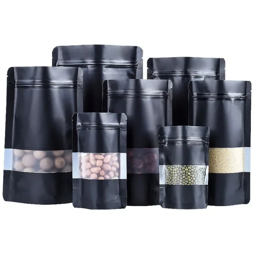 Black stand-up zipper pouches with clear windows for snacks and grains
