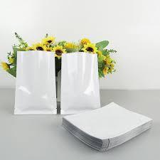 White stand-up zipper pouches with sunflowers, ideal for custom flexible packaging in Bangladesh