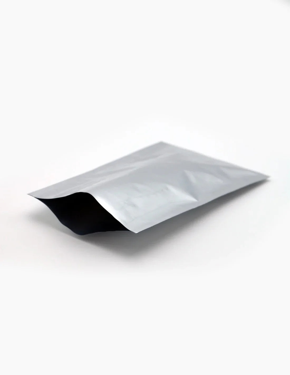 Silver stand-up zipper pouch with black interior, premium flexible packaging for brands