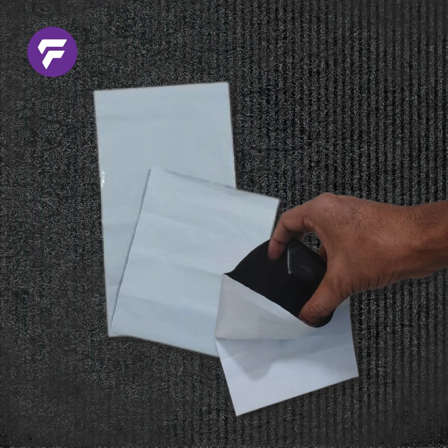 Hand holding white stand-up pouch with black interior, showcasing flexible packaging material
