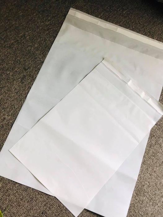 White stand-up zipper pouches for custom flexible packaging, ideal for wholesale brand supplies